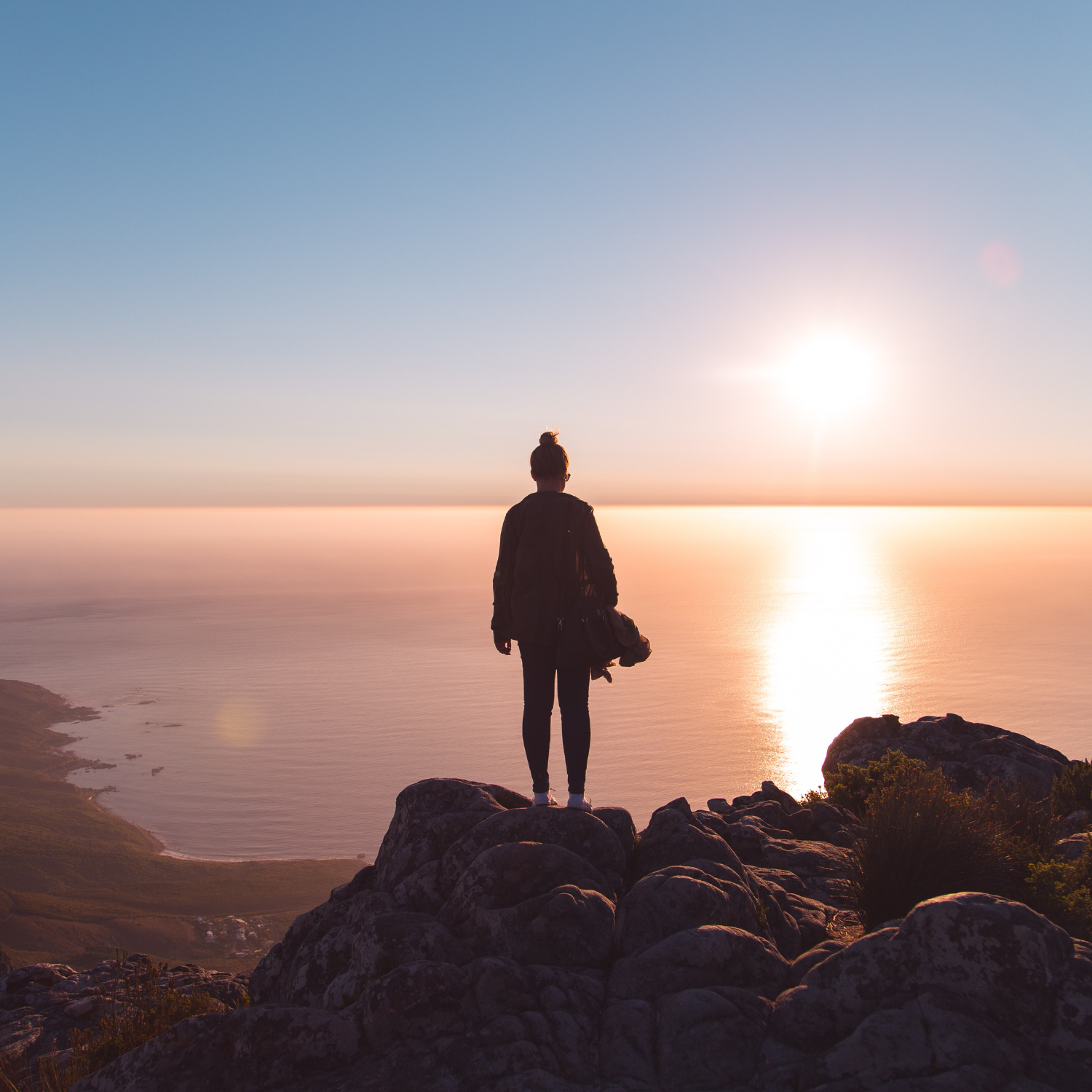 Pacific Harvest nutritionally complete lady looking out to sunrise on top of mountain